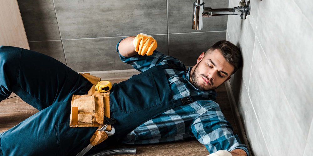 bearded-handyman-lying-on-floor-near-toolbox-in-ba-resize.jpg